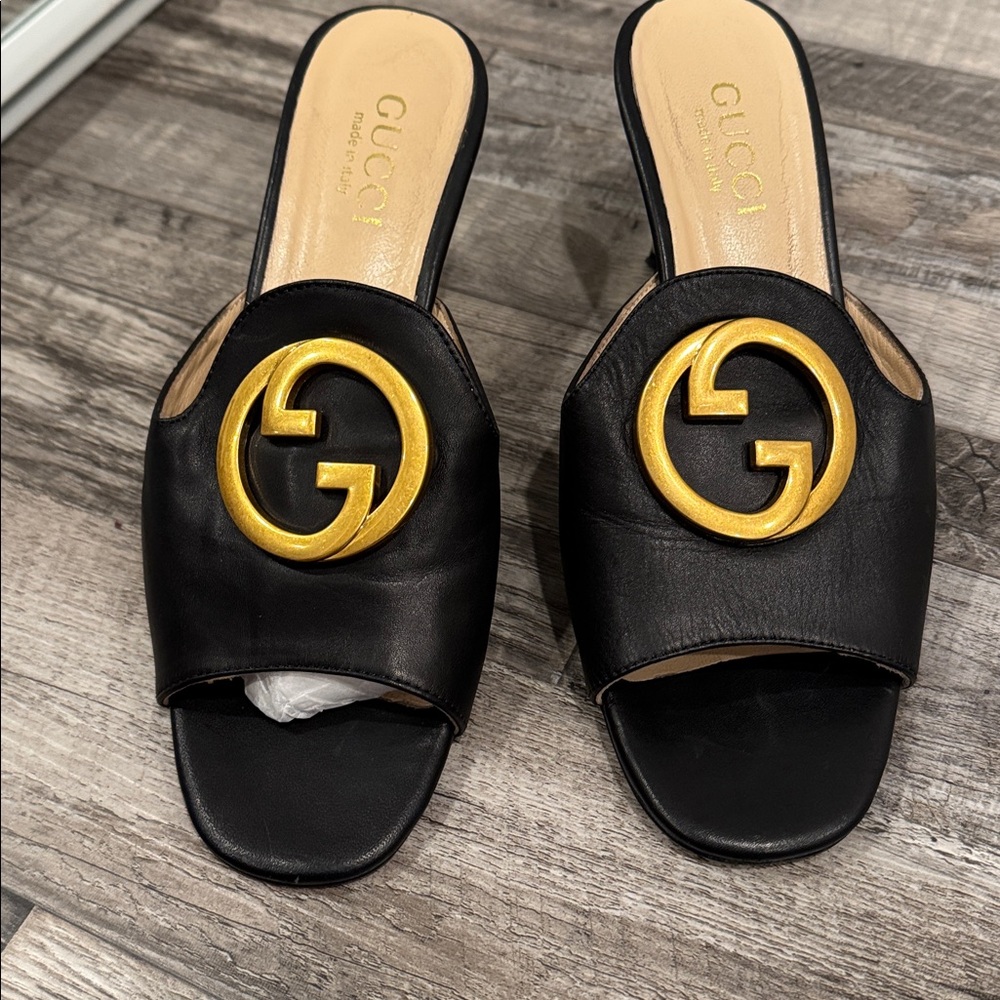 Gucci Black Leather Slides with Gold Emblem